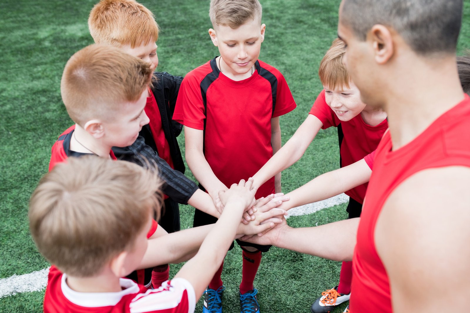 kids-joining-hands-before-match.jpg